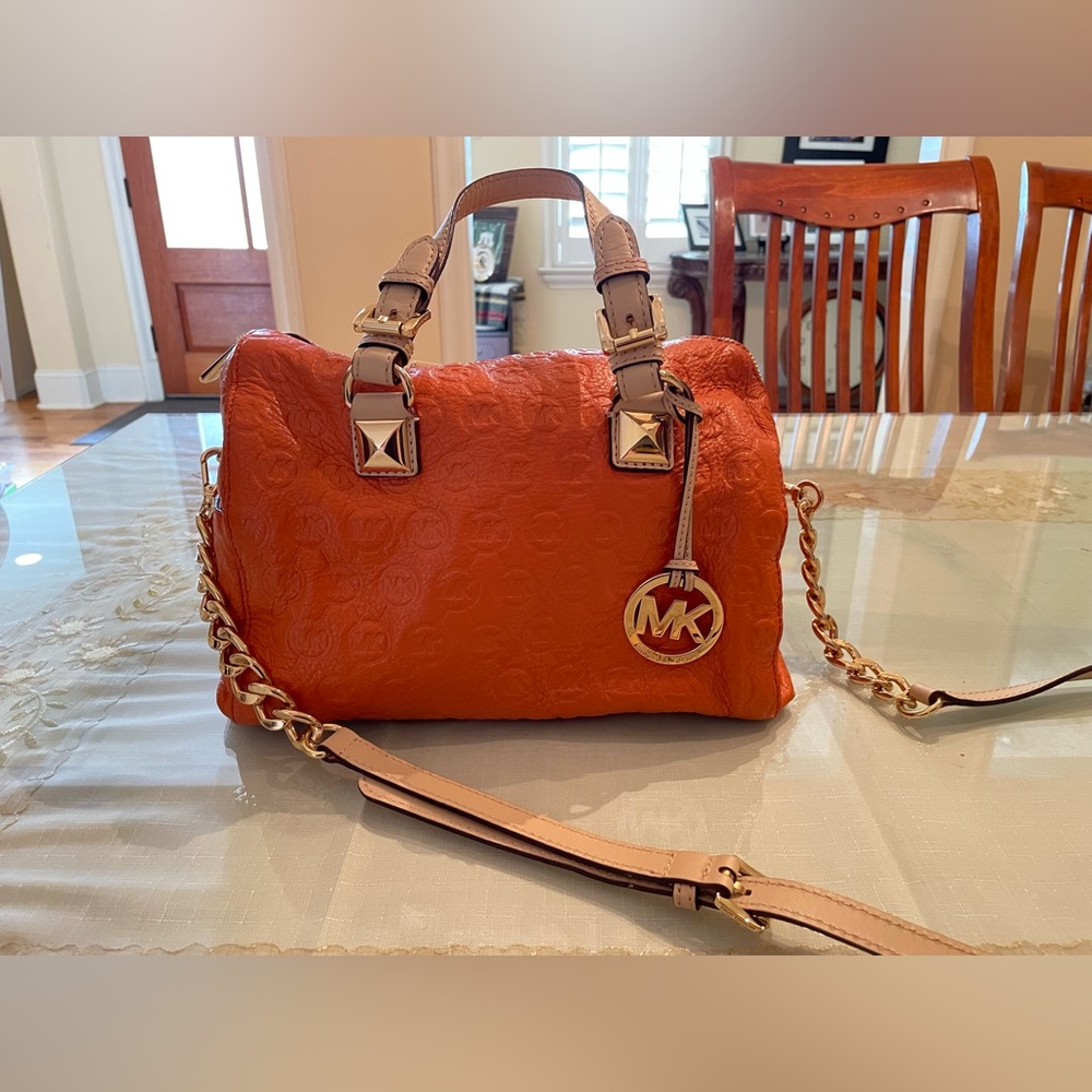 Michael Kors orange pebbled leather crossbody bag with chain and leather strap